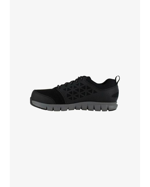 Reebok Кроссовки унисекс RE544A07Y черные 46 EU